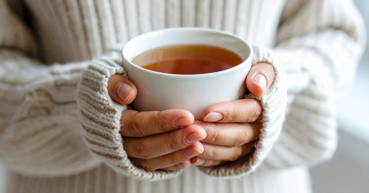 A calm matcha latte and herbal tea on a wooden table in soft morning light