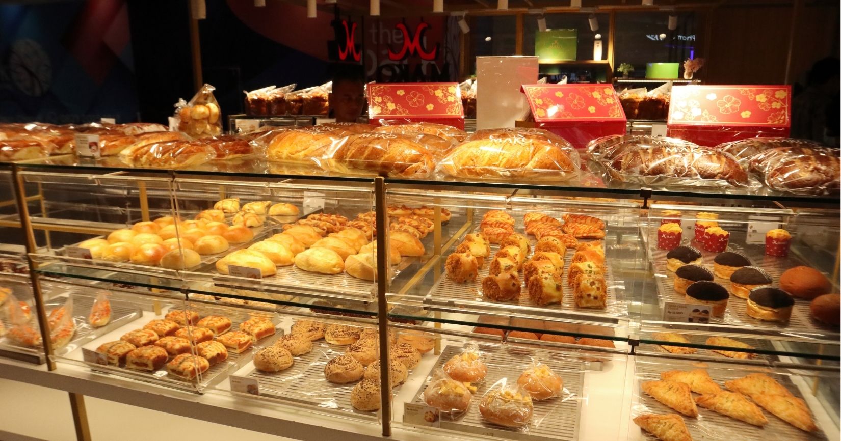 Starbucks food display case showing breakfast sandwiches, egg bites, pastries, and cake pops