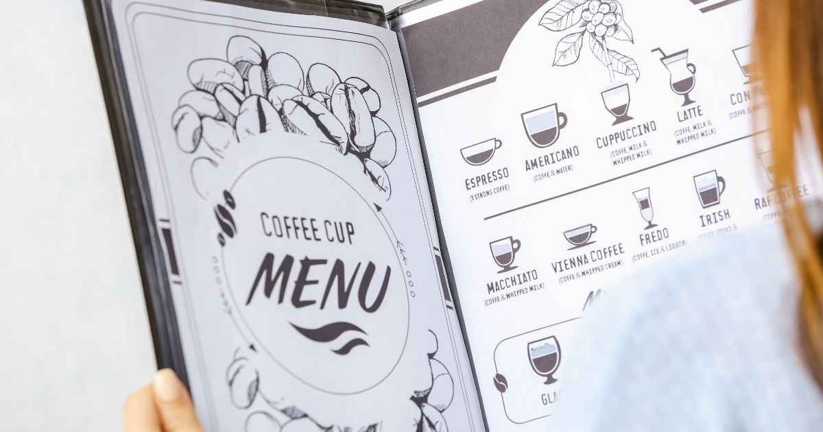 Beginner-friendly coffee drinks including a latte, cappuccino, and iced coffee on a café counter