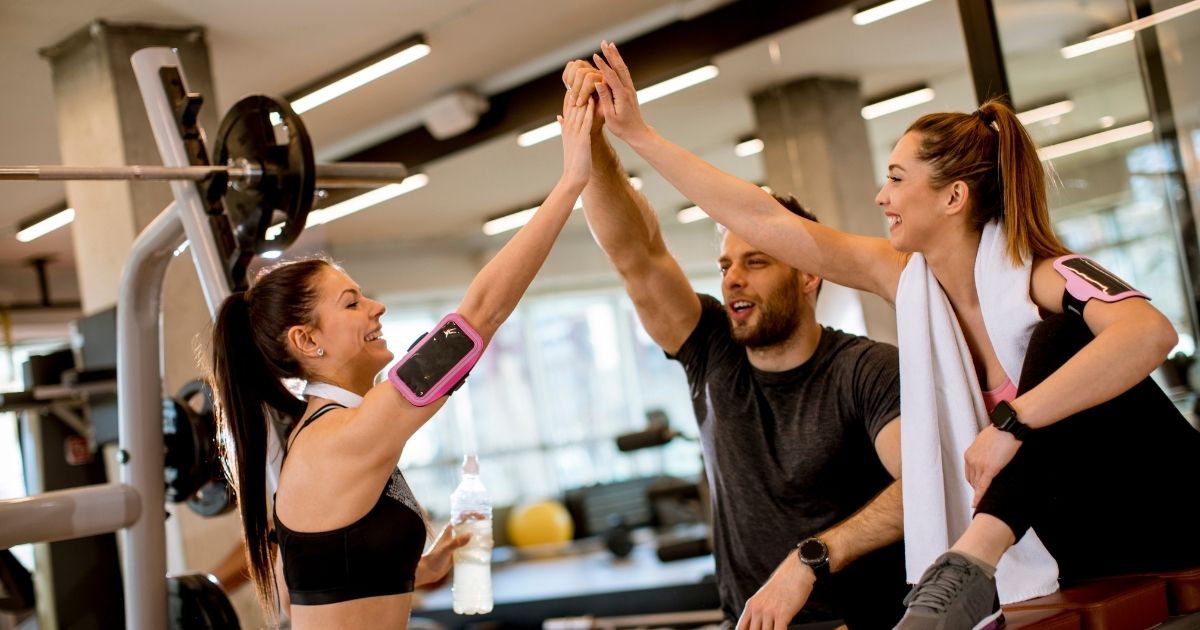 A protein coffee drink next to a shaker bottle and espresso shot showing the proffee trend