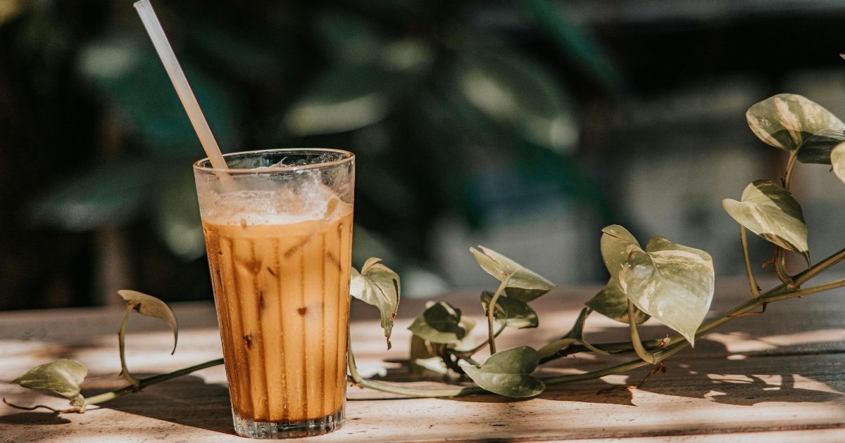 Bright colorful Starbucks iced summer drinks with tropical fruit and ice