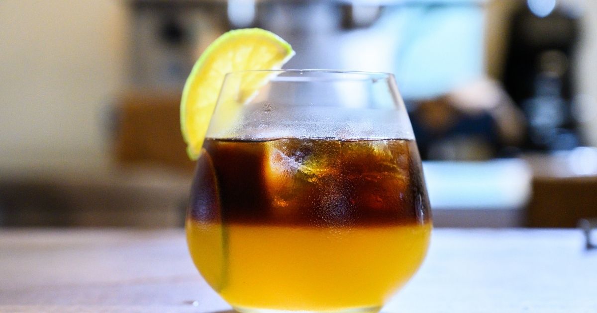 Popular Dunkin' drinks including iced coffee, cold brew, and a refresher on a counter