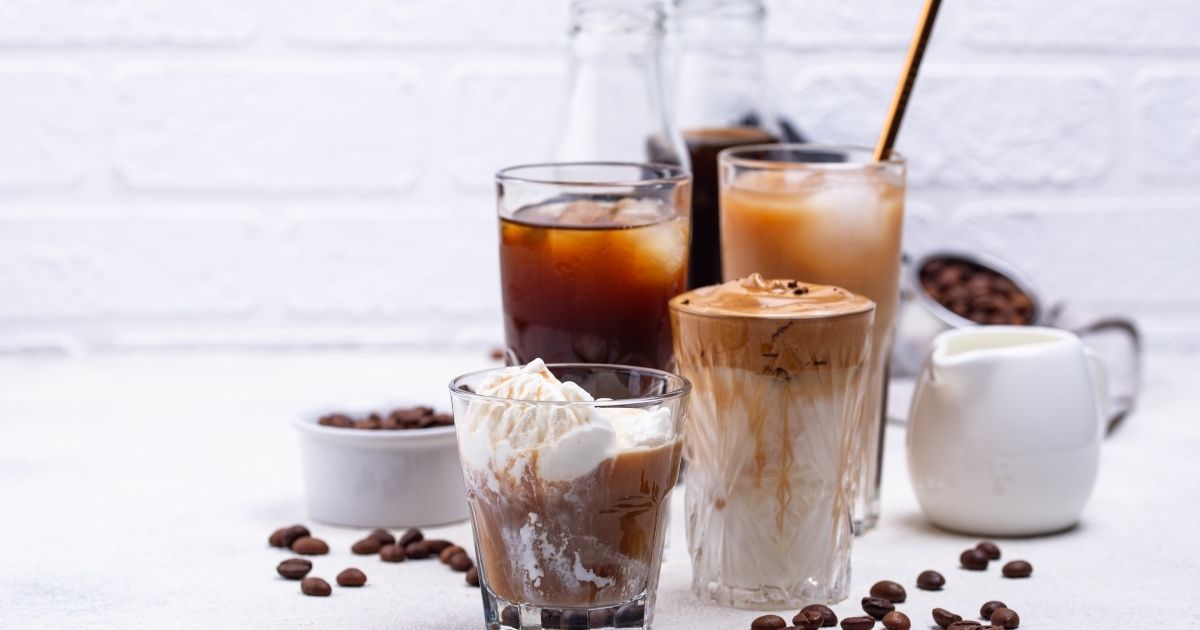 Colorful Dutch Bros drinks including a Golden Eagle and Blue Rebel energy drink at a drive-thru window